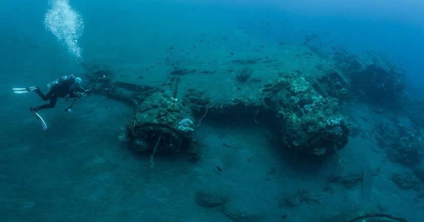 Craig Taylor diving a B17 wreck in the Solomon Islands. Image (c) Mick Harris